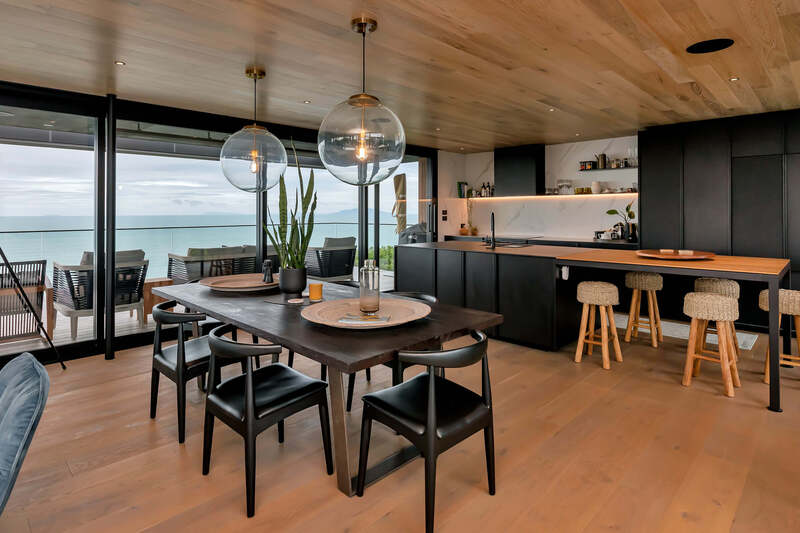 black kitchen with engineered timber floors nz